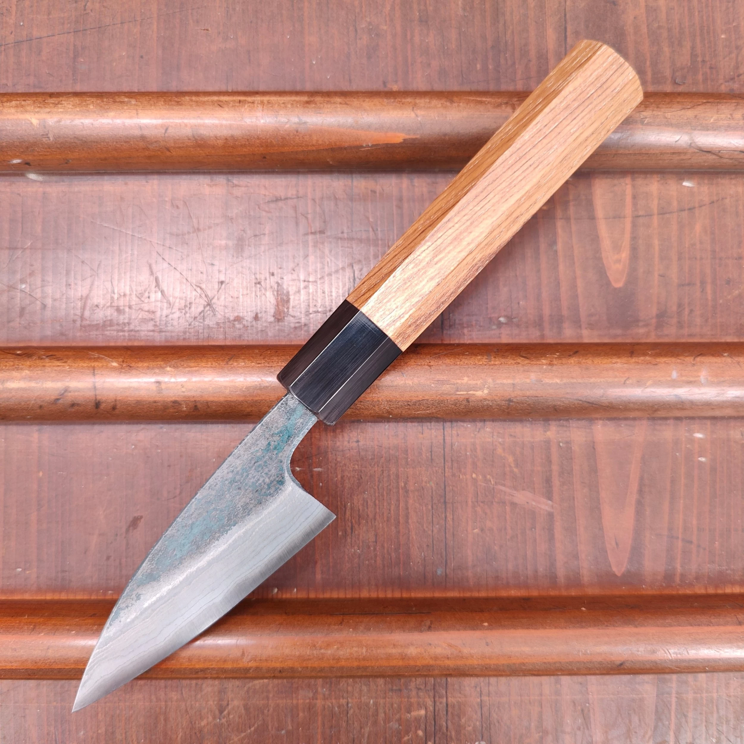 Kumokage 80mm Petty Aogami 2 Kurouchi Carbon Damascus Teak Horn 9 Kumokage 80mm Petty Aogami 2 Kurouchi Carbon Damascus Teak Horn - Image 7